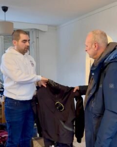 A photo of Rick is showcasing the latest addition to our dive center